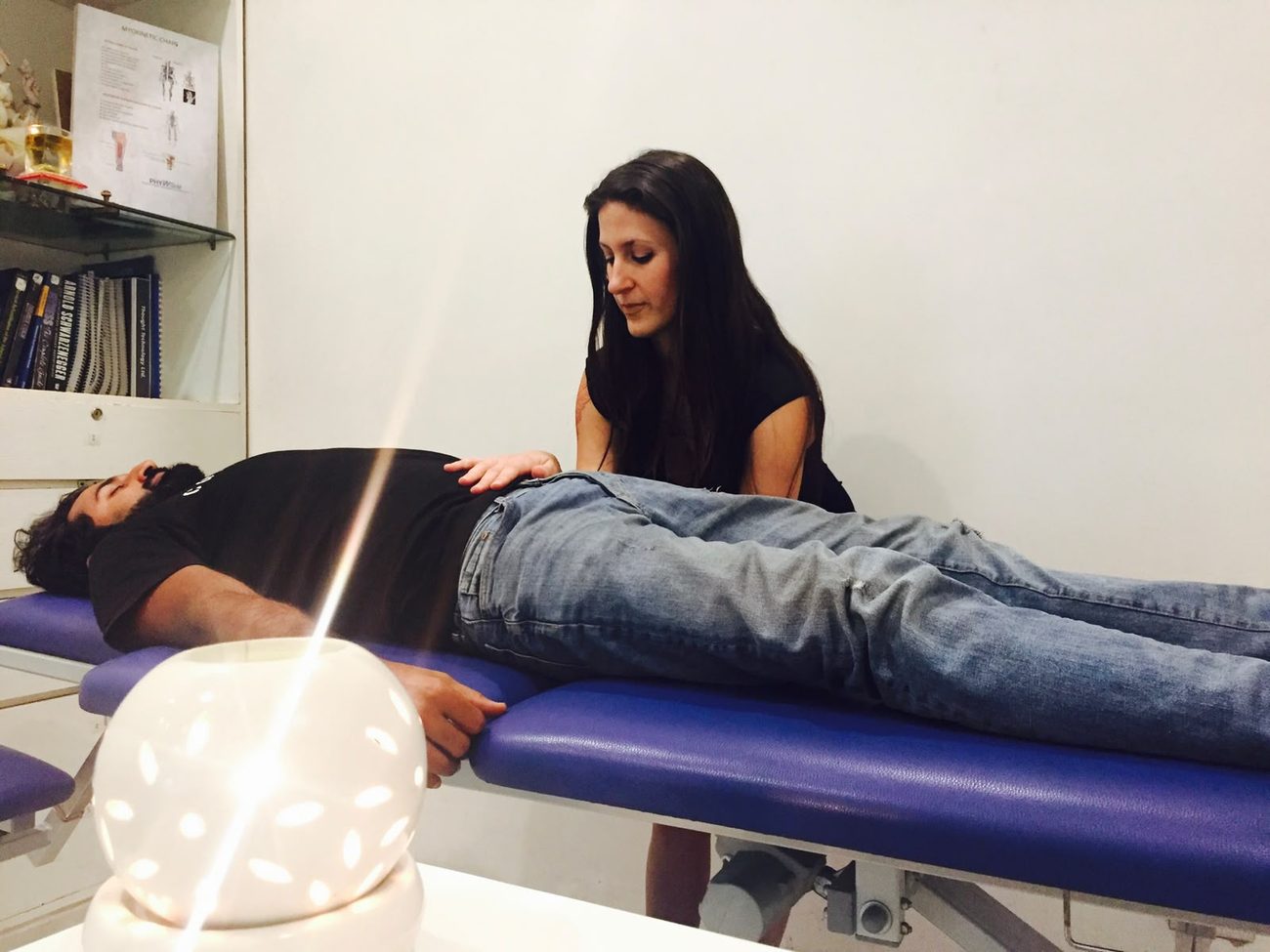 Craniosacral hold on a client at PHYWorld